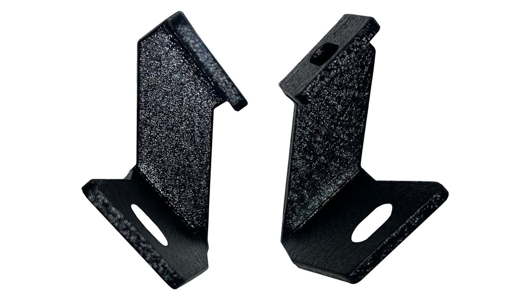 A Fishbone Offroad Pod Light Bracket designed for 2015-2023 F150 and 2017-2023 Ford Raptor trucks, suitable for all cab and bed configurations