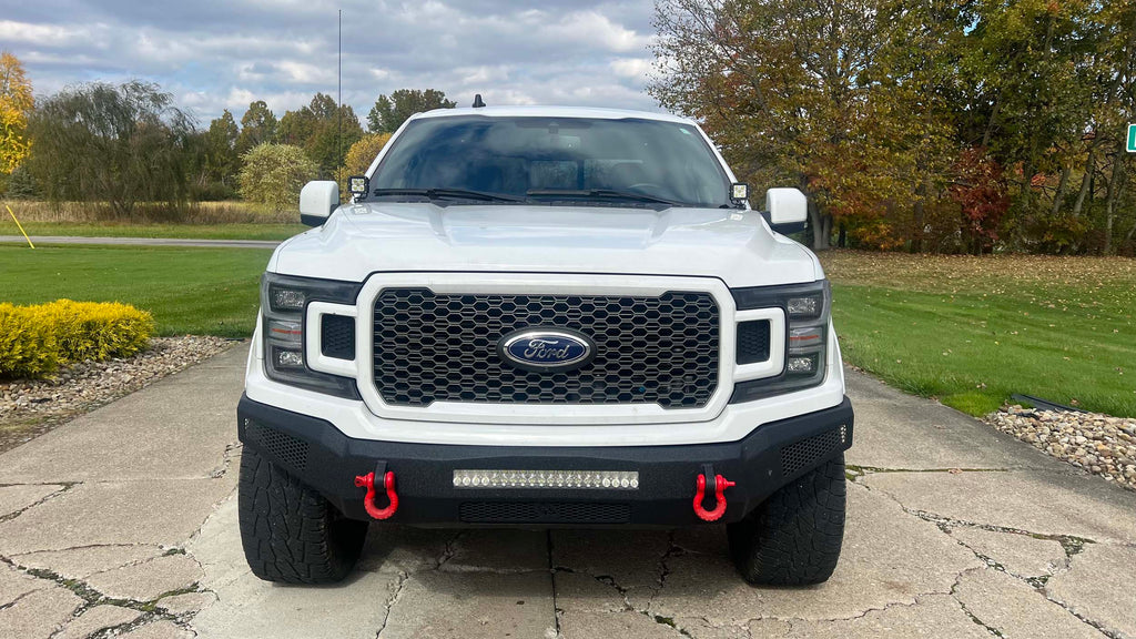 A Fishbone Offroad Pod Light Bracket designed for 2015-2023 F150 and 2017-2023 Ford Raptor trucks, suitable for all cab and bed configurations