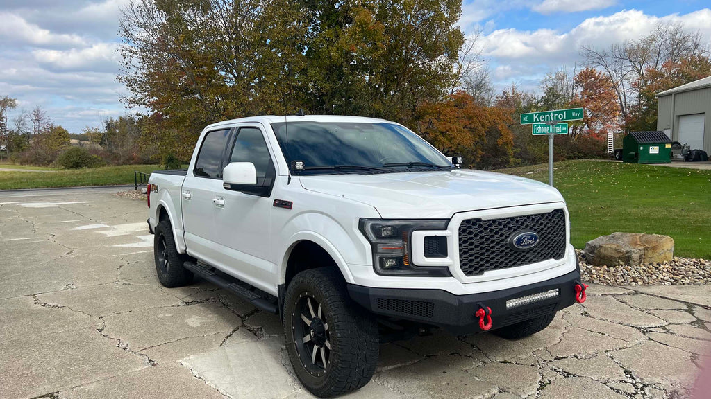 A Fishbone Offroad Pod Light Bracket designed for 2015-2023 F150 and 2017-2023 Ford Raptor trucks, suitable for all cab and bed configurations