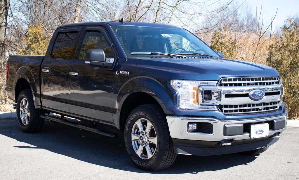 Fishbone's 5-inch oval side steps in black textured finish, designed for Ford Super Crew Cabs, showcasing the molded grip and fully welded dome ends