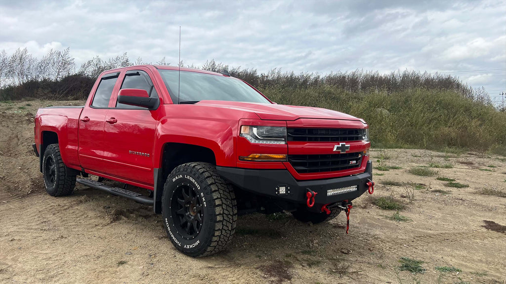 Robust 5-inch oval side steps with a distinct black textured finish, tailored for Chevrolet & GMC Double cab pickups, featuring a molded Fishbone grip step pad.