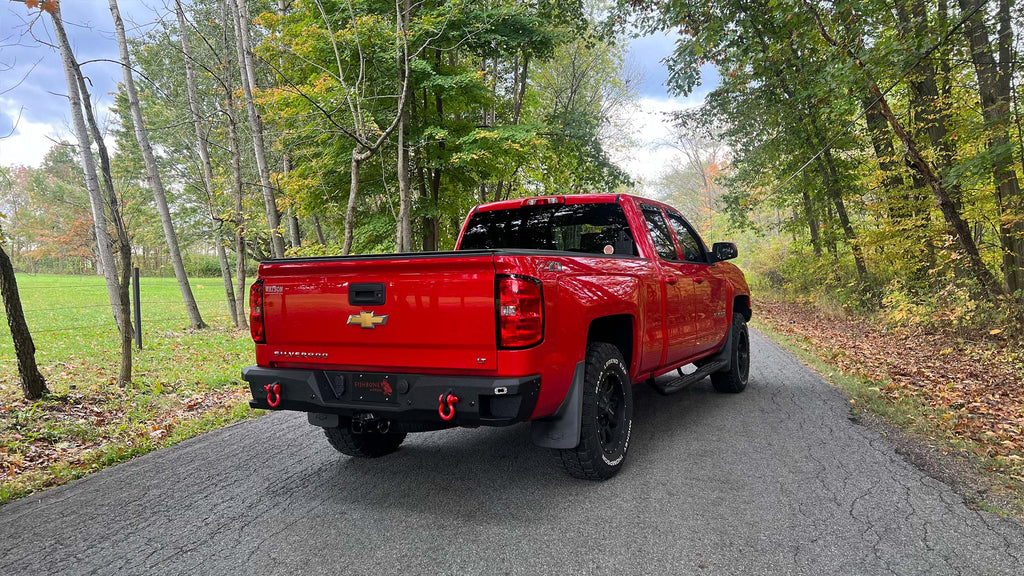 Robust 5-inch oval side steps with a distinct black textured finish, tailored for Chevrolet & GMC Double cab pickups, featuring a molded Fishbone grip step pad.