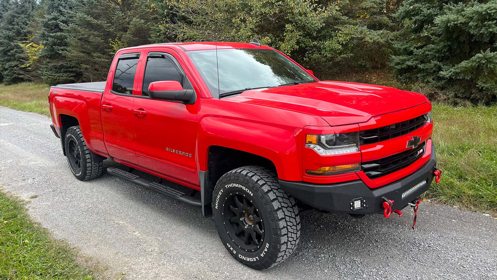 Robust 5-inch oval side steps with a distinct black textured finish, tailored for Chevrolet & GMC Double cab pickups, featuring a molded Fishbone grip step pad.