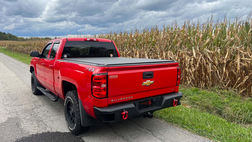 Robust 5-inch oval side steps with a distinct black textured finish, tailored for Chevrolet & GMC Double cab pickups, featuring a molded Fishbone grip step pad.