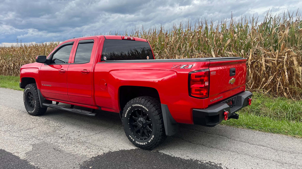 Robust 5-inch oval side steps with a distinct black textured finish, tailored for Chevrolet & GMC Double cab pickups, featuring a molded Fishbone grip step pad.