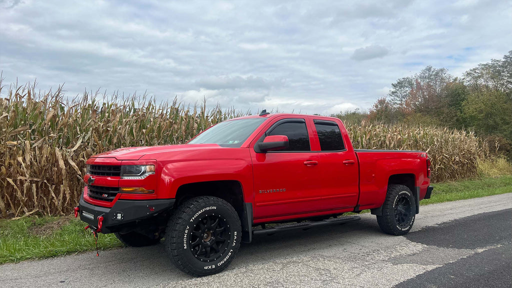 Robust 5-inch oval side steps with a distinct black textured finish, tailored for Chevrolet & GMC Double cab pickups, featuring a molded Fishbone grip step pad.