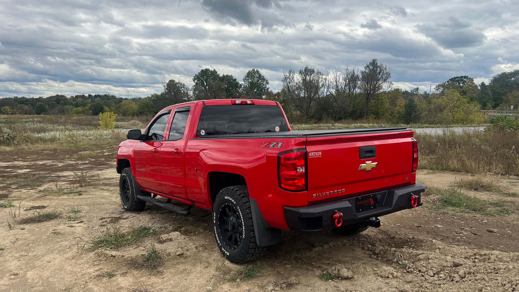 Robust 5-inch oval side steps with a distinct black textured finish, tailored for Chevrolet & GMC Double cab pickups, featuring a molded Fishbone grip step pad.