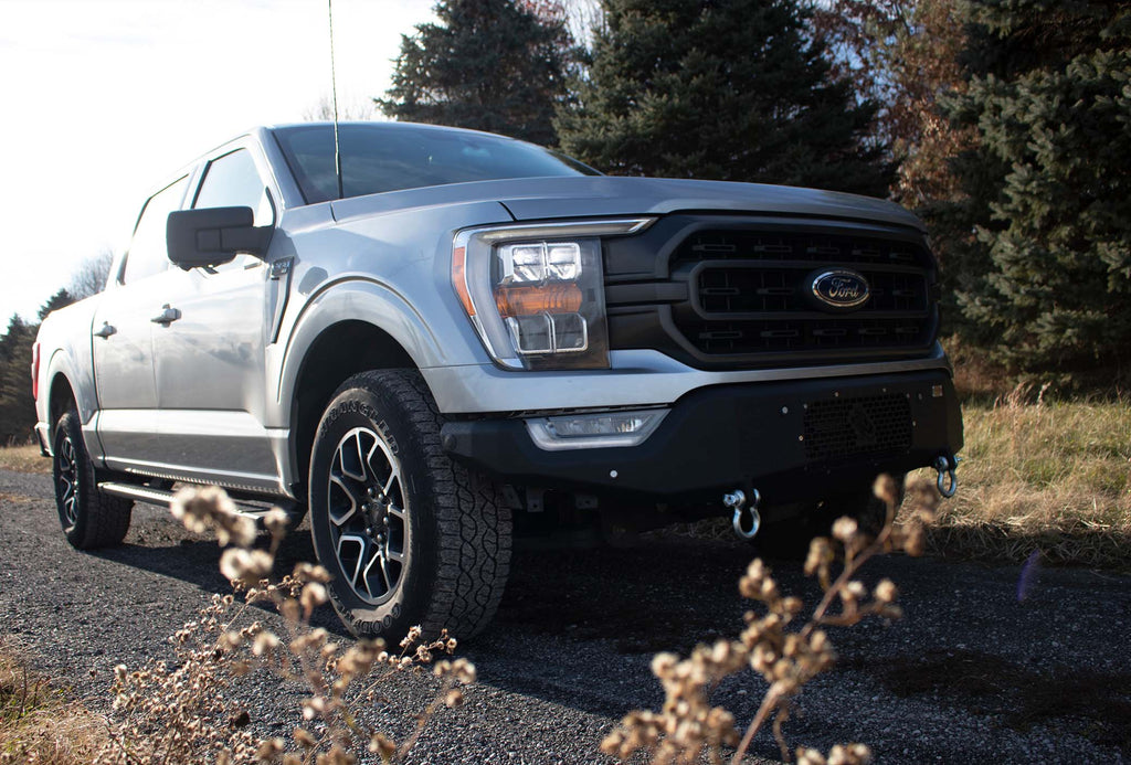 Fishbone Offroad Pelican Front Bumper with black texture powder coat and provisions for Factory OE park sensors on a 2021-Current Ford F-150.